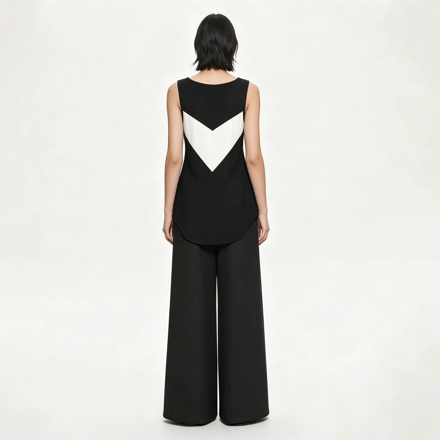 Lapargay Black and White Contrast Sleeveless Vest Geometric Cut Curved Back Hem Slimming Top L63101913C